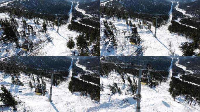 现代滑雪缆车舱在山上的极端轨道上移动