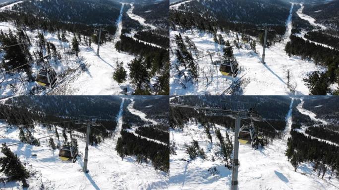 现代滑雪缆车舱在山上的极端轨道上移动