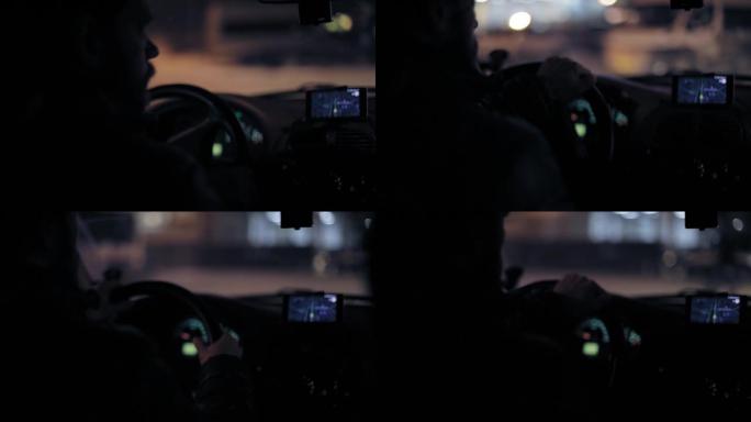 一名男子上车，打开智能手机上的导航器