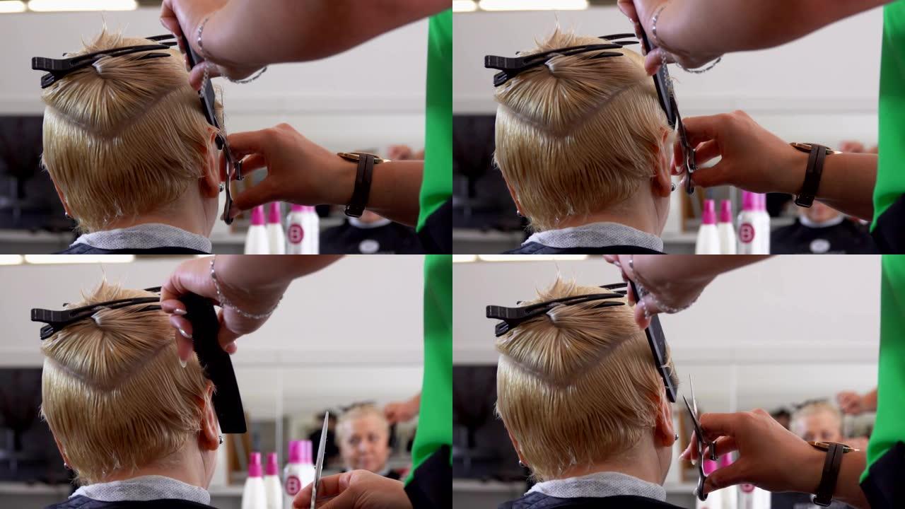 美发师用剪刀为客户理发的手的特写