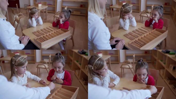 幼儿教师在幼儿教室里和女孩玩耍