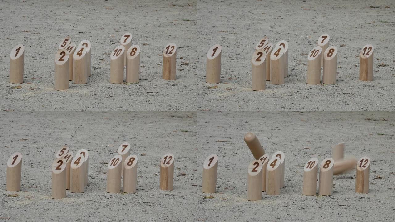 芬兰原创户外趣味游戏，沙滩上有木制别针m ö lkky