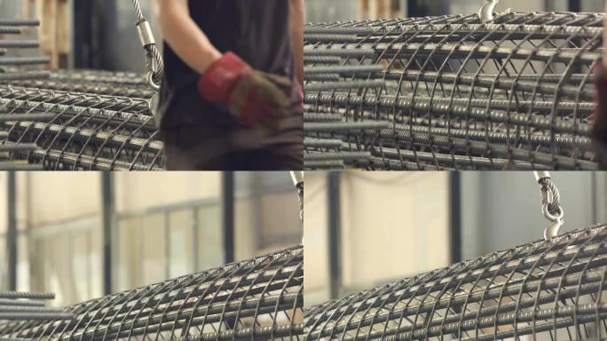 金属加工厂重型起重准备中的堆叠式圆柱钢筋。