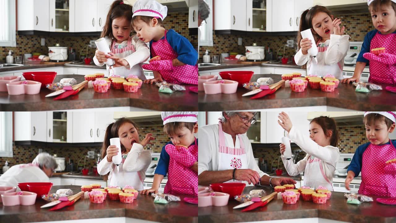 小女孩和男孩和祖母一起烹饪情人节松饼