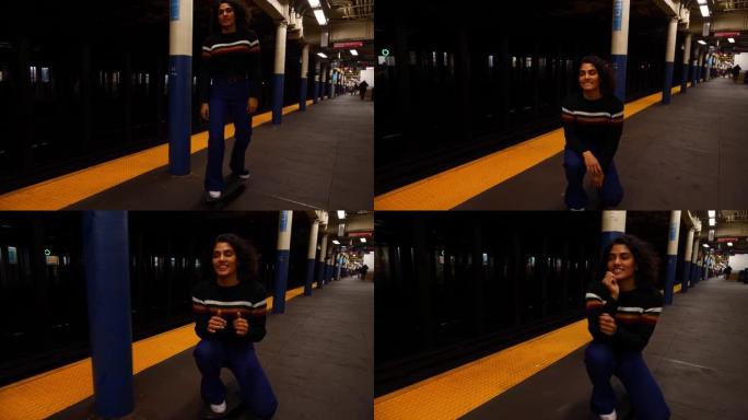 年轻的多种族西班牙裔学生女孩在纽约市地铁站玩滑板。