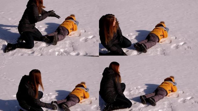 母亲带着一个小孩在打雪球，他们躺在雪地上扔雪