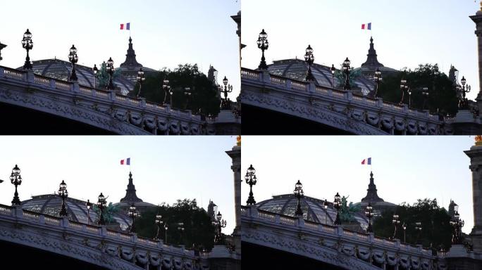 大皇宫大楼上的法国国旗。塞纳河上的亚历山大三世大桥。