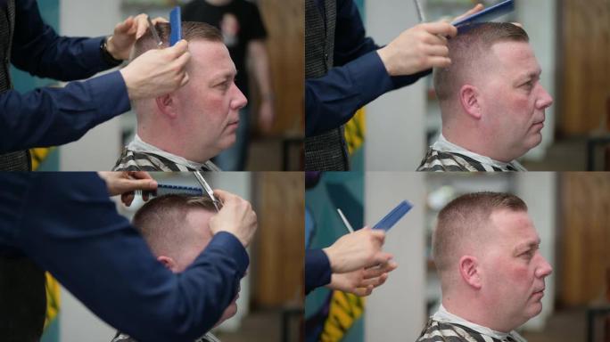 理发店的男士理发。主人用剪发剪一个金发男人的特写