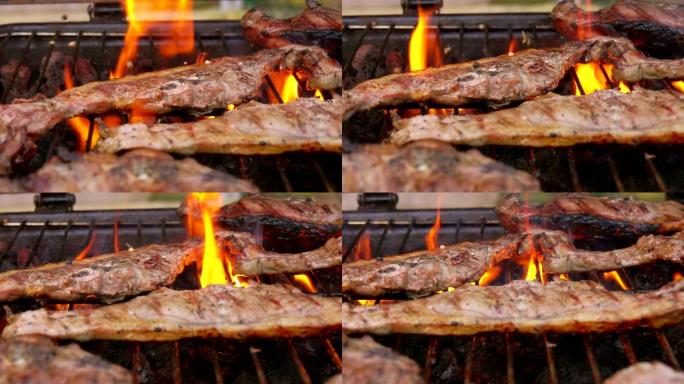 在带有火焰的烤架上撒上胡椒粉的肉