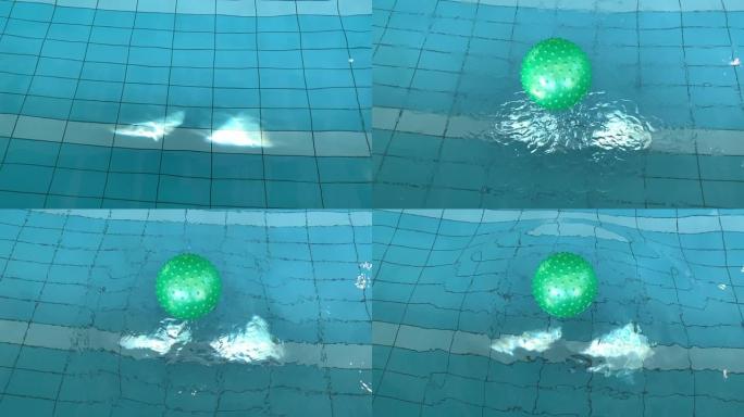 落在水中的绿球水滴底下一个绿色重力球抛向