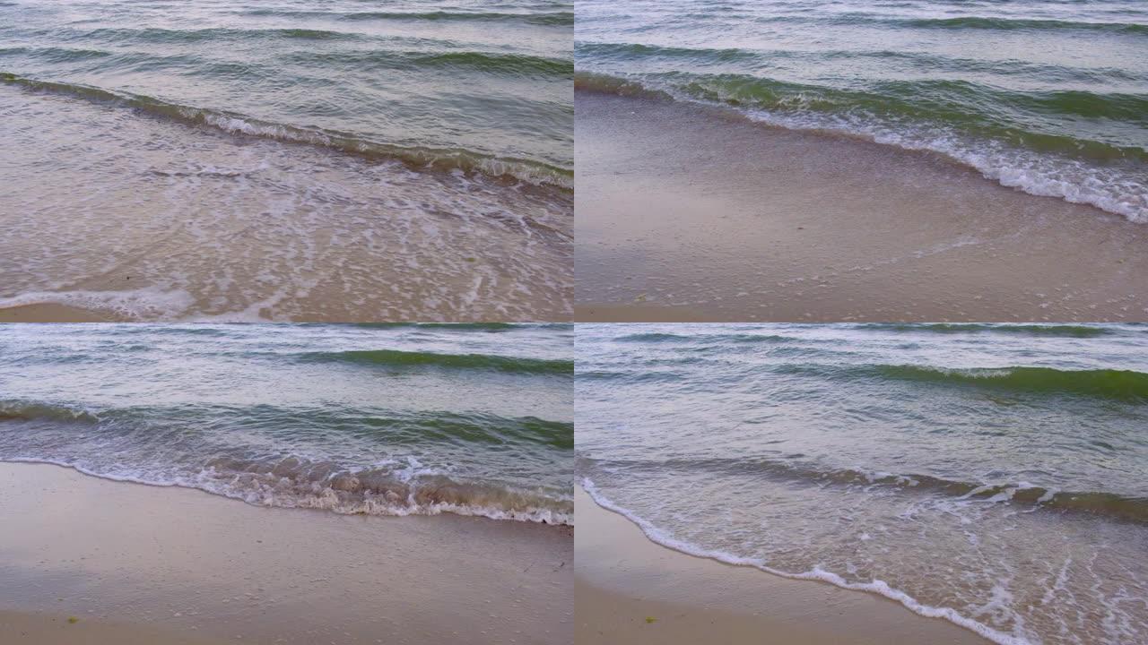 在夏天的一天，乌克兰热列兹尼港的村庄，黑海的海浪在沙滩上飞溅，