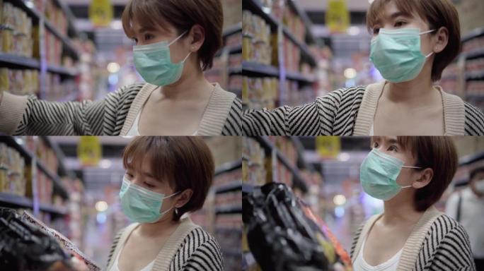 亚洲妇女在杂货店使用污染口罩
