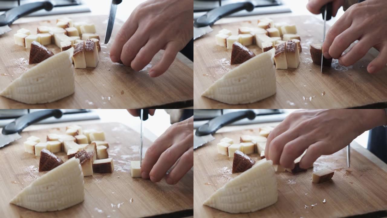 4k 50 fps女人切割的镜头，在切菜板上准备切尔克斯奶酪。