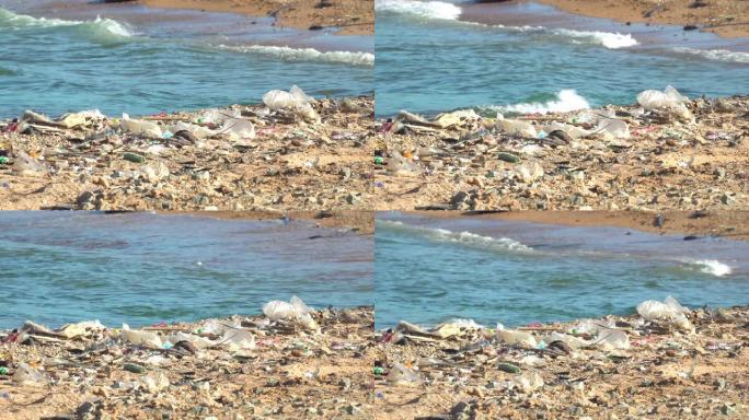 塑料瓶和其他废物被扔到海滩和海洋中。环境污染问题的概念