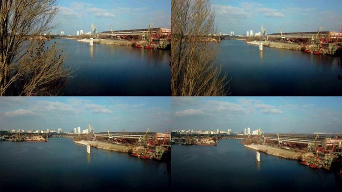 乌克兰基辅。鸟瞰图，无人机在第聂伯河上的造船厂上方飞行。东欧基辅的奥博隆区