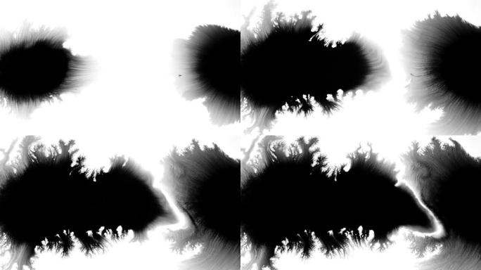 白色背景上传播的黑色水彩画滴