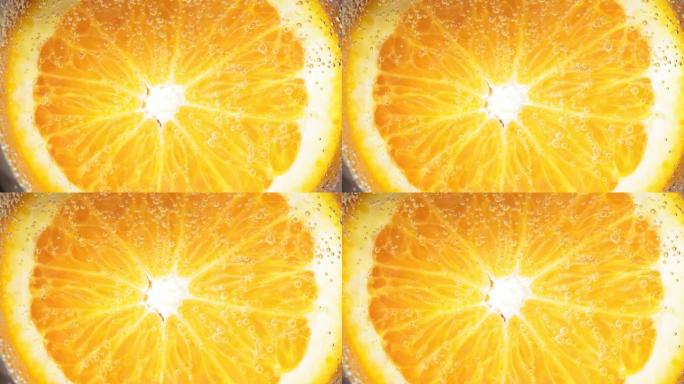 水滴或果汁成熟橙子的特写镜头。水果散发出新鲜感和汁液。水果的饮食和健康食品概念