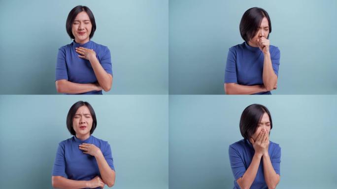 亚洲女性的肖像在蓝色背景上被孤立的喉咙痛。4k视频