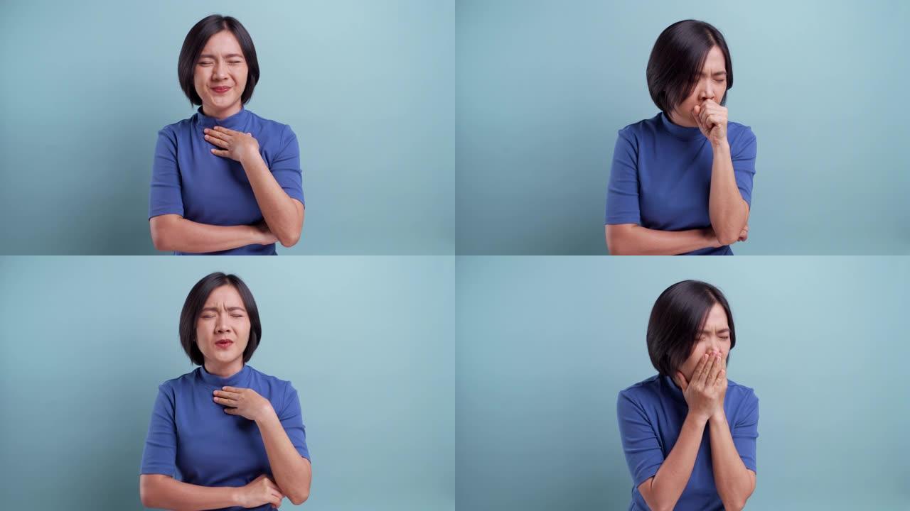 亚洲女性的肖像在蓝色背景上被孤立的喉咙痛。4k视频