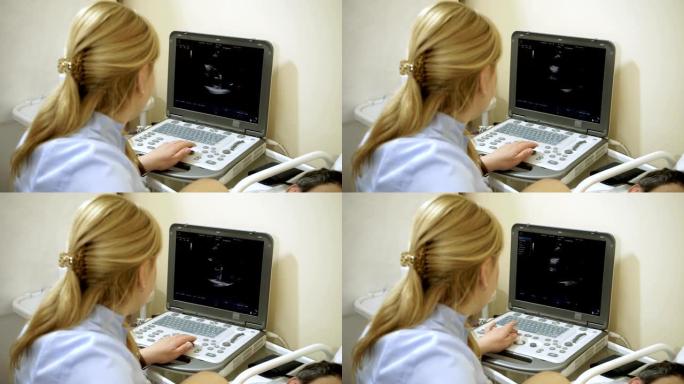 女医生用超声波设备检查病人的心脏。高清