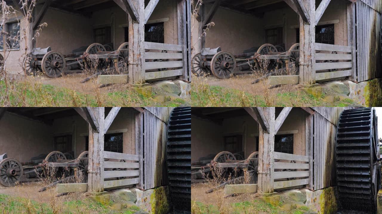 木制服务器和带瀑布的纺车的旧磨坊棚