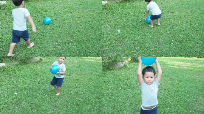 小男孩开心地打球。