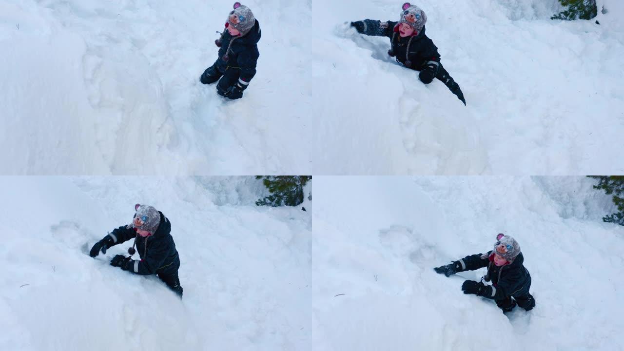 这个男孩在外面玩雪