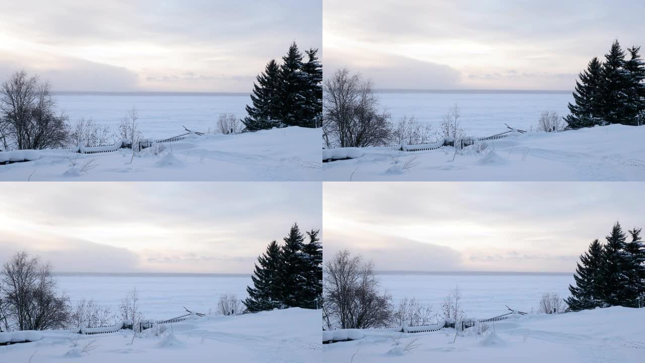 冬季景观。冰冻的叶尼塞河景色。位于西伯利亚的俄罗斯村庄。俄罗斯。4K