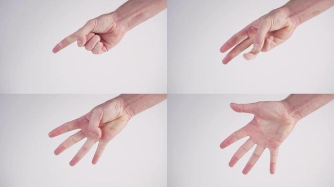 一个年轻人用手指在白色背景上显示1到5的数字。国际手语