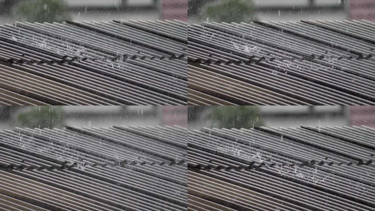 屋顶上的水滴，夏天的暴风雨。-慢动作录像。