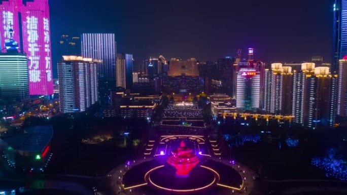 夜间照明青岛市著名海湾纪念碑广场空中全景延时全景4k中国