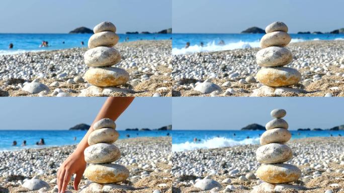 这孩子在海滩上保持石头平衡