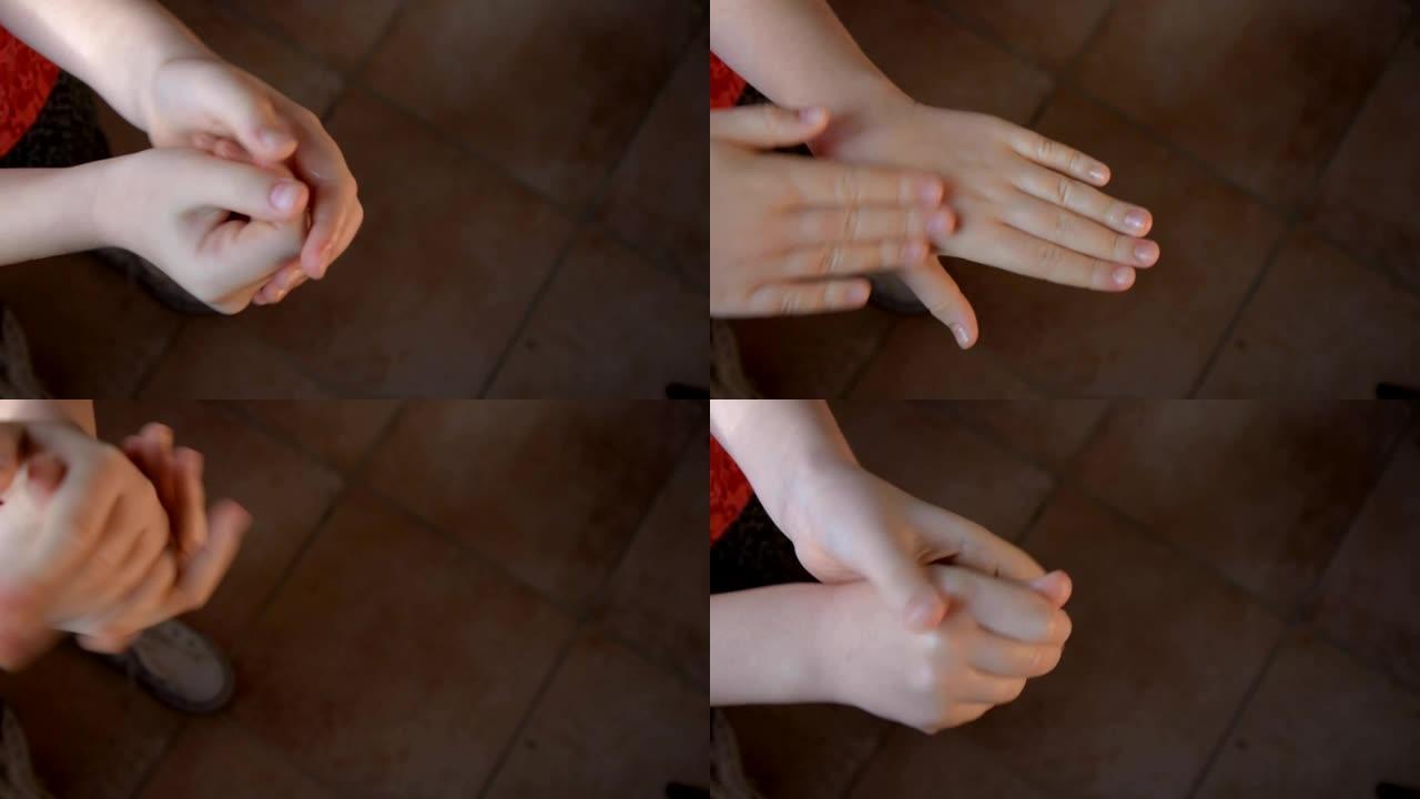 女性的手将抗菌凝胶/酒精消毒剂倒在女孩的手上。孩子洗手，收到一个红苹果。顶视图