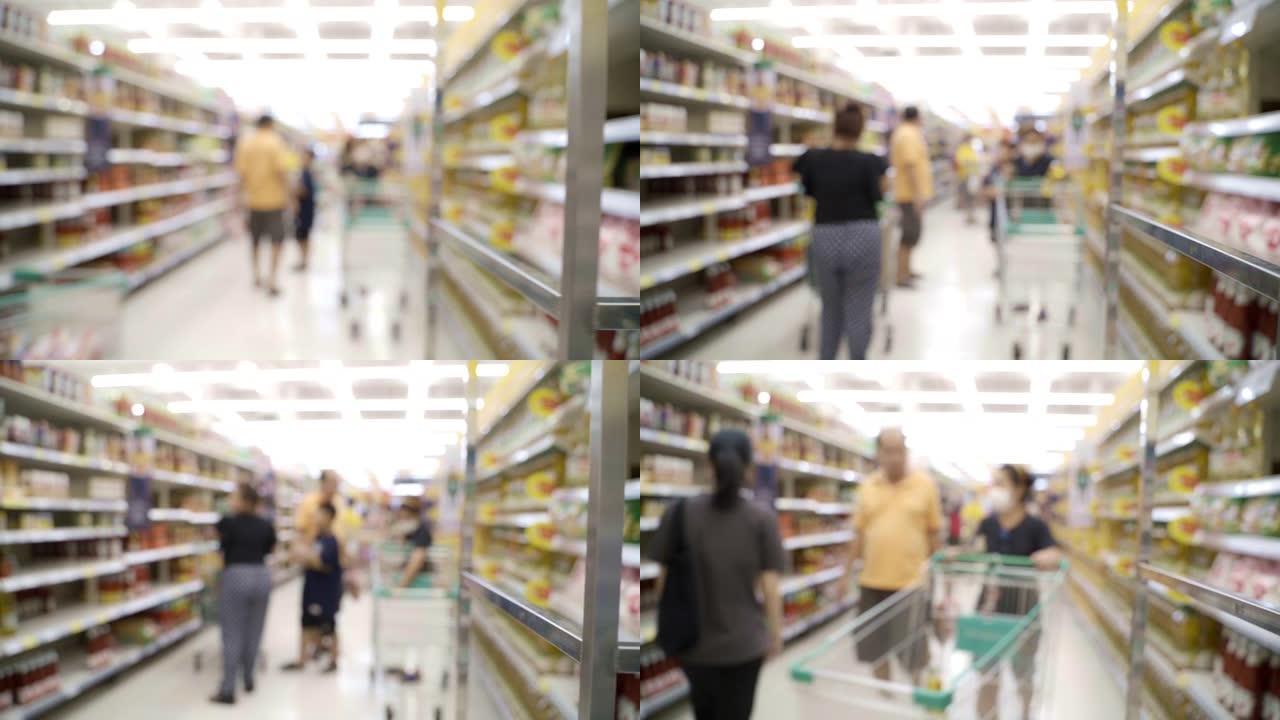 泰国政府宣布关闭泰国后，模糊的背景人群购买和购物以储备带有口罩保护的食品。