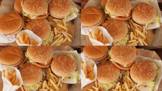 不健康食物的一部分，快餐，一堆汉堡，薯条旋转，顶视图