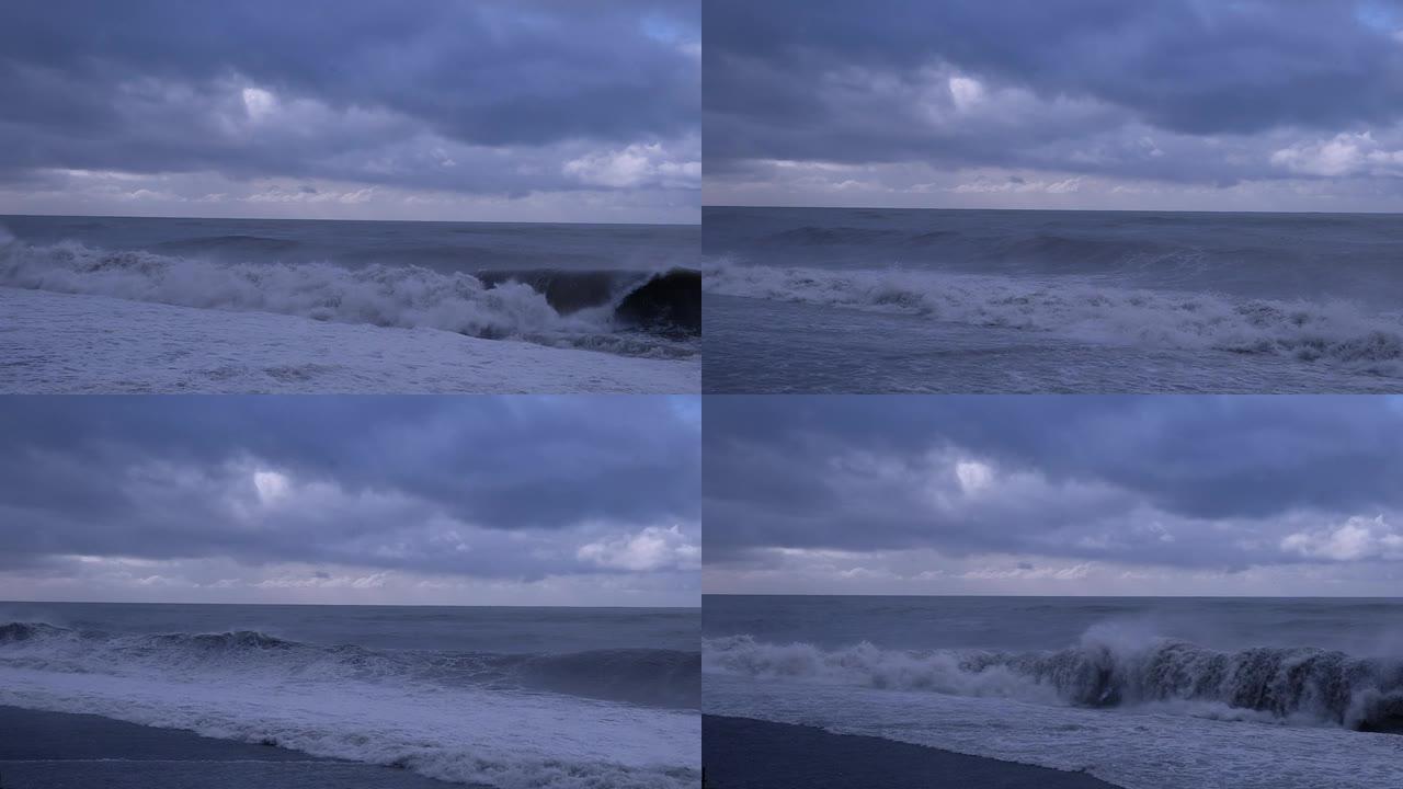 大浪冲向海岸线。喷涂泡沫。