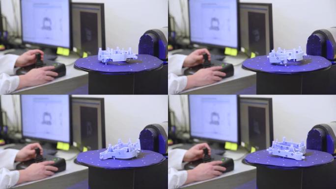 技术专业的机器，用于使用激光对塑料模制品进行3D扫描和测量。