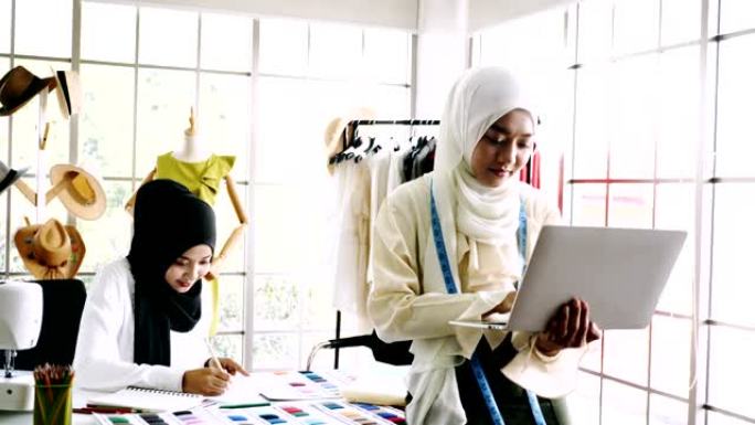 穆斯林女性时装设计师正在创建新衣服系列。