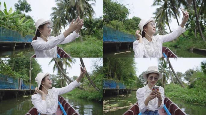女人在度假泰国计程车船上戴帽子拍照