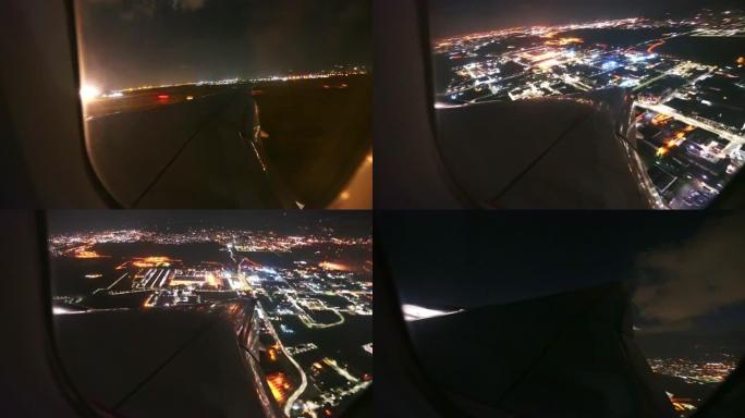 一架飞机在城市上空的夜间鸟瞰图