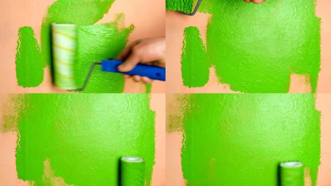 人类用油漆滚筒将粉红色的墙壁涂成鲜绿色。