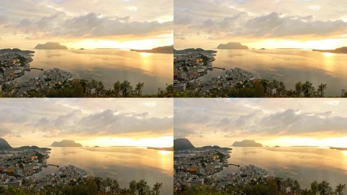 挪威奥勒松。阿勒sund群岛上方暖色的惊人自然明亮的日落戏剧性天空。著名的挪威地标和热门目的地。全景