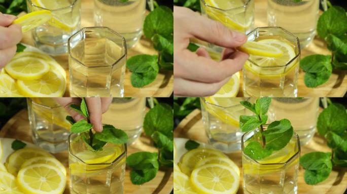 一杯新鲜柠檬水配柠檬、薄荷。夏季健康的柑橘鸡尾酒注入水，减肥排毒饮料。