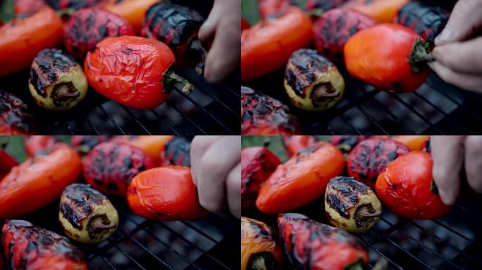 户外烤架上的辣椒特写镜头显示火焰和烟雾。蔬菜烤架。烧烤