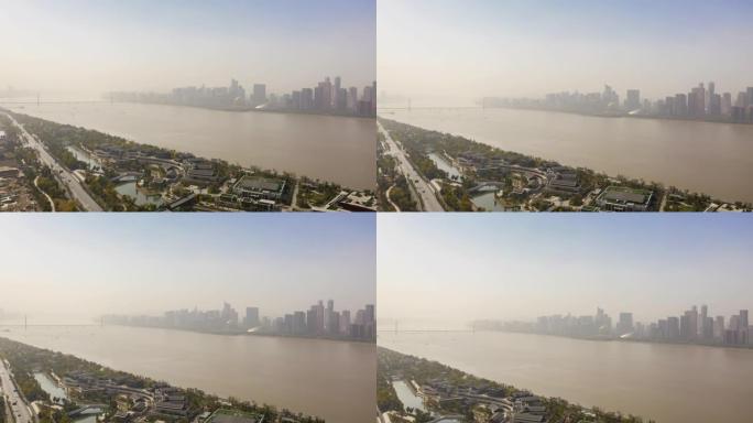 阳光明媚的日子杭州市中心景观河边交通公园综合体海湾空中延时全景4k中国