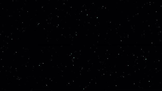 黑色背景上闪闪发光的颗粒的白色闪闪发光的星尘痕迹。
