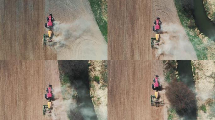 农村田间地面施肥带播种机种植玉米粒的拖拉机