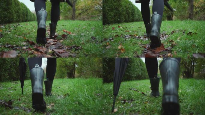穿靴子的女人在潮湿的草地上行走