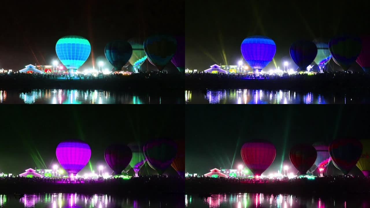 气球彩灯节和反光在水上。