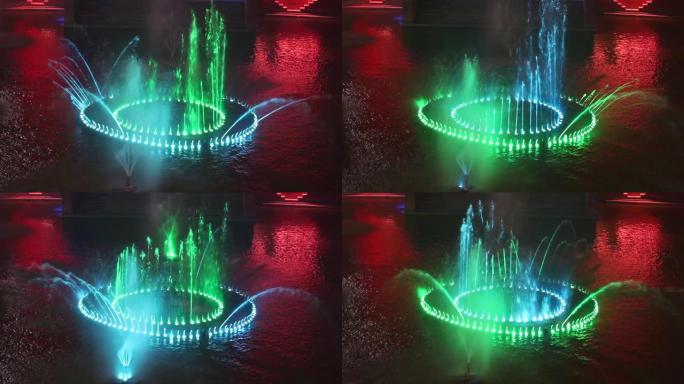 夜晚灯光节期间，水池上的彩色音乐喷泉